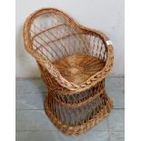 A small vintage child's wicker chair,