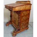 A pretty late Victorian walnut Davenport desk with a stationary compartment to top over a writing