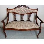 An Edwardian 2 seater parlour sofa in a floral material,