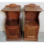 A pair of 20th century pitch pine bedside/pot cupboards,