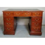 A Victorian mahogany pedestal desk with a green leather top over drawers to one side,