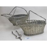 A pair of white metal basket type wine p