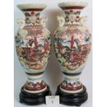 A pair of large and decorative Japanese Satsuma pottery vases, c.