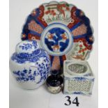 Four pieces of traditional Japanese ceramics, comprising an Imari dish, miniature Satsuma vase,