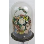 A Victorian shell-work centre piece, formed as a basket of flowers,