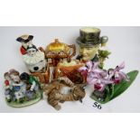 A collection of decorative and ornamental ceramics, including a Winston Churchill character jug,