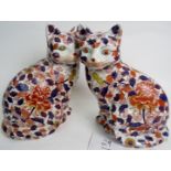 A pair of Japanese Imari ceramic models of seated cats, 20th century, 28cm high,