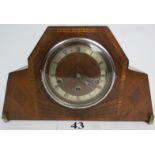 A 1930's Art Deco cross-banded walnut veneered cased chiming mantel clock,