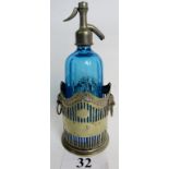 A vintage Jules Henri blue glass soda syphon bottle, and a silver plated bottle stand,