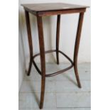 A 20th century side table with a lower bentwood support, 77cm high,