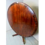 A fine 19th century circular crossbanded mahogany tilt top breakfast table terminating on a
