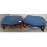 A pair of 19th century low footstools with gilded style feet and upholstered in a pale blue