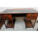 A Victorian mahogany converted kneehole desk with a black leather top over 4 small drawers and