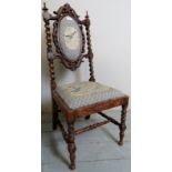 A pretty Victorian carved walnut framed hall chair upholstered in tapestry material with bird