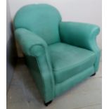 A Victorian armchair upholstered in a green material,