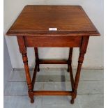 An early 20th century oak square occasional table with turned legs and stretcher,