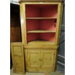 A 19th century tall pine corner cupboard in need of some attention (top doors require hinges),