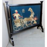 A large decorative Egyptian tapestry screen depicting figures in a horse drawn carriage,