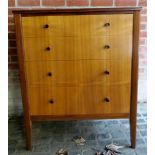 A c1960's walnut chest of four long drawers terminating on tapered legs and in very clean condition,