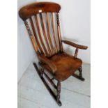 A 19th century mahogany Windsor rocking chair,