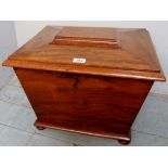 A 19th century mahogany sarcophagus wine coioler with a six section lined interior,