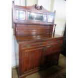 An Edwardian mahogany mirror back sideboard in good condition with 2 short drawers over cupboards,