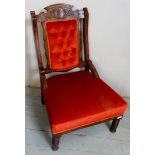 A late Victorian low ladies chair upholstered in button backed red/orange material,