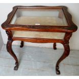 A late Victorian carved rosewood Bijouterie display cabinet with a butterfly top,