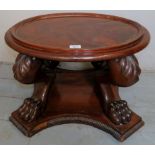 A Victorian flame mahogany oval top jardiniere/cooler stand with ornate legs and lion claw feet