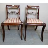 A pair of Regency Revival mahogany framed occasional chairs with applied metal mounts and