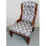 A late Victorian mahogany framed nursing chair re-upholstered in a contemporary fabric,