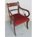 A small Regency mahogany occasional desk chair with scroll arms and a red upholstered drop in seat