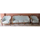 A 20th century continental Loius XV-style 3 piece suite with walnut showwood and upholstered in a