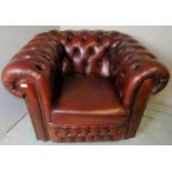 A 20th century brown leather Chesterfield armchair,