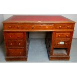 A Victorian oak pedestal desk with a tooled red leather top over eight drawers,