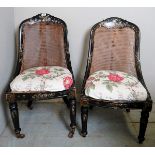 Pair of late Victorian ebonised inlaid Mother of Pearl bergere chairs, slightly A/F,