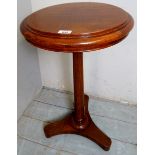 A Victorian rosewood/mahogany pedestal wine table with turned column and platform base,