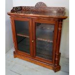 A 19th century walnut 2 door side cabinet with fretwork gallery to top, H40" x W36",