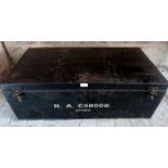 A 20th century black travelling trunk, inscribed `H A Condon',