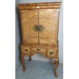 A Georgian-style period walnut drinks cabinet with double cupboard doors over 3 small drawers to