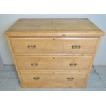 A 19th century pine chest of three long drawers with brass handles,