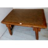 A 20th century elm coffee table with a snakeskin style inset top,