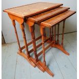 A nest of three graduated yew wood side tables,