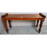 A small Victorian carved window seat with scroll ends over turned legs, 47cm x 92cm,