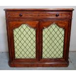 A Victorian mahogany chiffonier/side cabinet with a long single drawer to top over arched fabric
