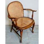 A small bergere style elbow chair,