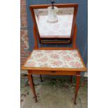 A pretty walnut ladies dressing table with a swing mirror over a single drawer,