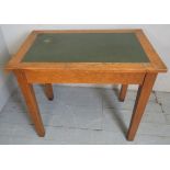 A 19th century oak writing table with a