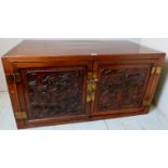 A 20th century Chinese hardwood cupboard