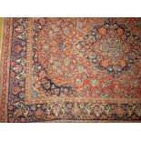 A classic antique Farahan rug, madder an
